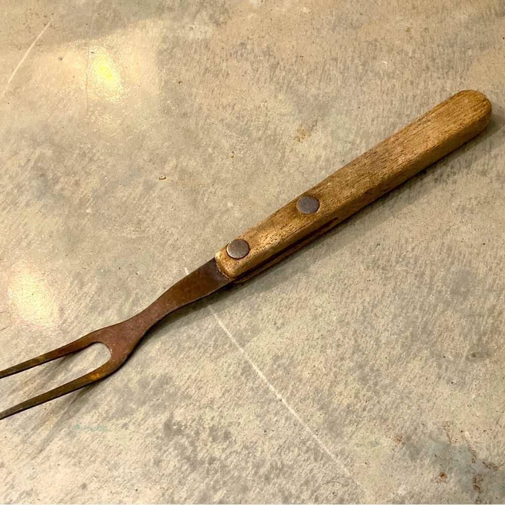Antique weathered meat fork.
